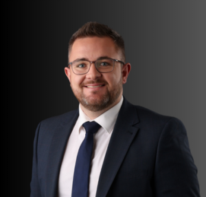 Professional portrait of a man in a suit and tie, representing the senior team at Layer 4, a managed IT services provider focused on IT and cloud solutions for UK businesses.