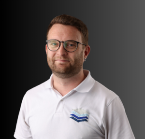 Professional portrait of a man in a white polo shirt with a blue logo, representing the senior team at Layer 4, a managed IT services provider.