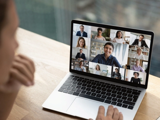 Employee joining a Microsoft Teams video meeting on a laptop